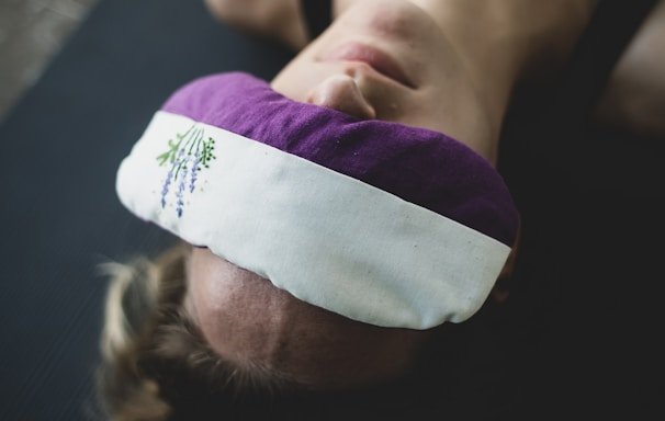 Person lying in Shavasana for relaxation